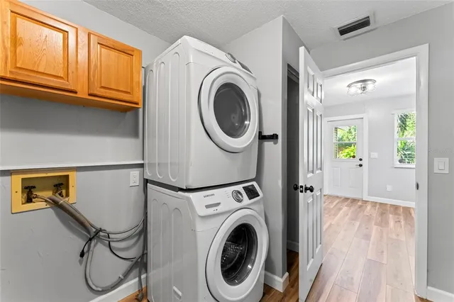 a view of room with hardwood floor and window