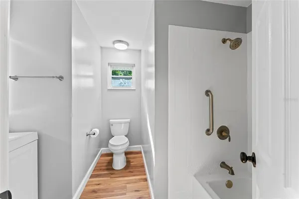 a bathroom with a granite countertop shower