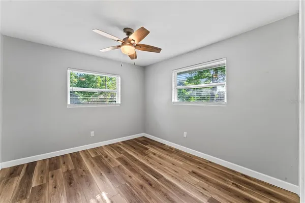 a view of room with window and ceiling fan