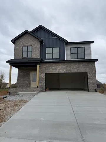 a view of a house with large windows