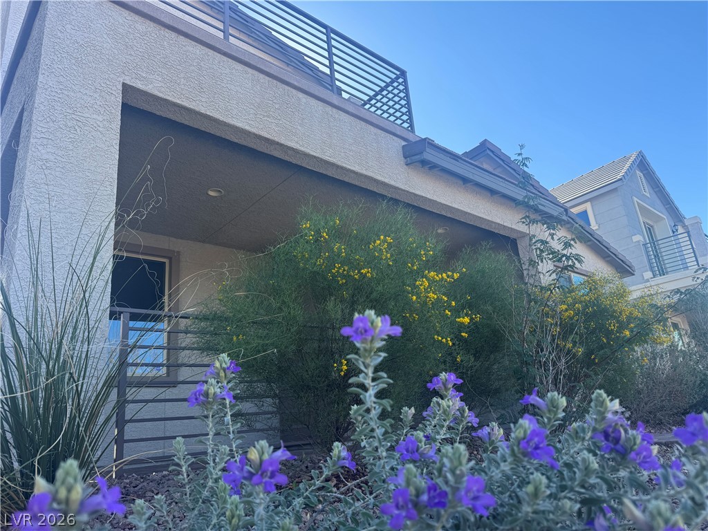 1051 East Sunset Road Henderson, NV 89011 - Photo 1 of 36 View of side of home with stucco siding