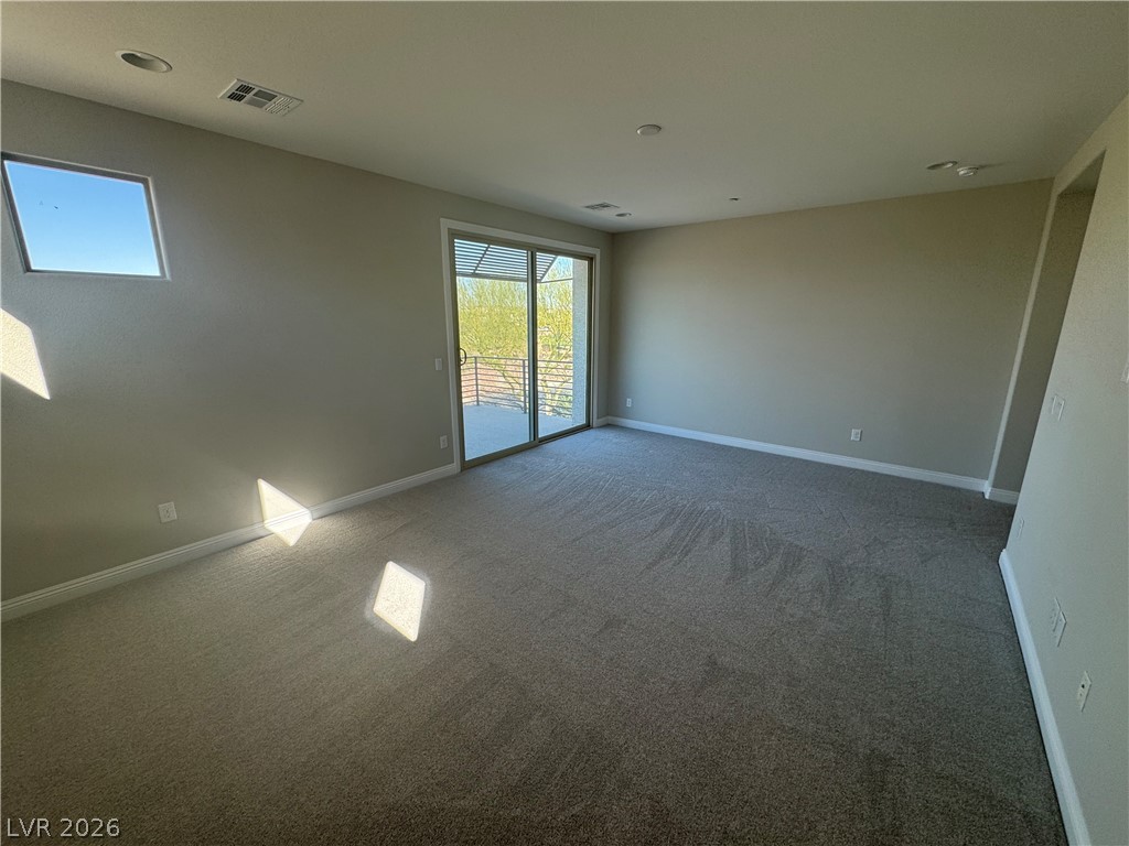1051 East Sunset Road Henderson, NV 89011 - Photo 20 of 36 Carpeted empty room with baseboards