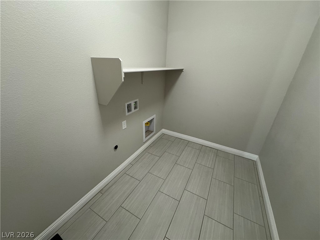 1051 East Sunset Road Henderson, NV 89011 - Photo 27 of 36 Laundry room featuring hookup for a washing machine, wood finish floors, and hookup for an electric dryer