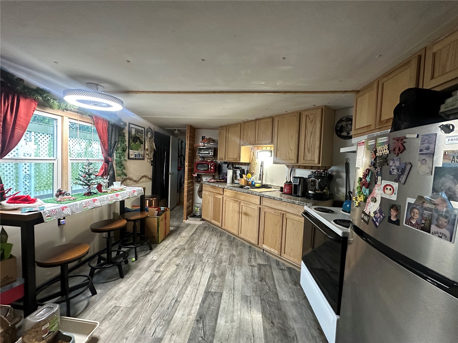 8080 Harborview Road, Unit M180 Blaine, WA 98230 - Photo 2 of 2 a kitchen with stainless steel appliances granite countertop sink stove top oven and cabinets