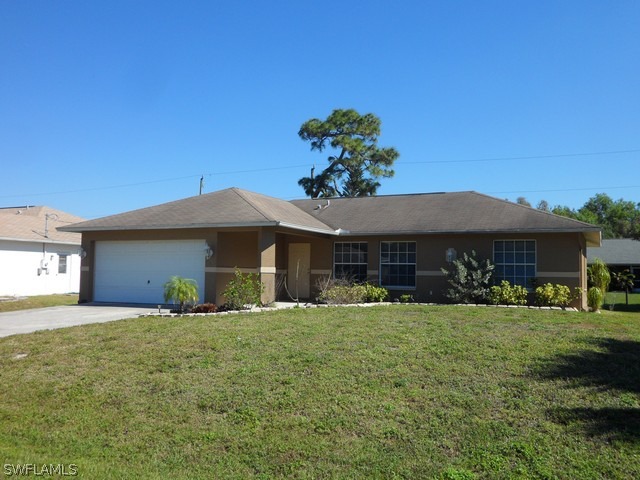 18395 Fern Road Fort Myers, FL 33967 - Photo 1 of 21 a view of a house with a yard