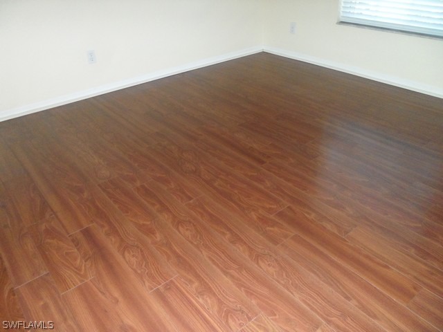 18395 Fern Road Fort Myers, FL 33967 - Photo 13 of 21 an empty room with wooden floor