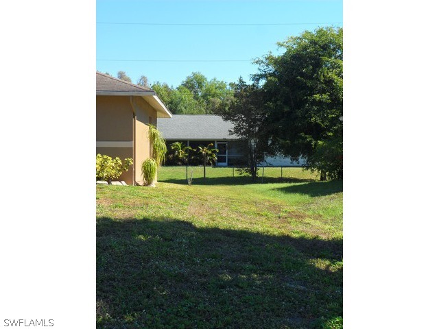 18395 Fern Road Fort Myers, FL 33967 - Photo 21 of 21 a view of a house with yard and a garden