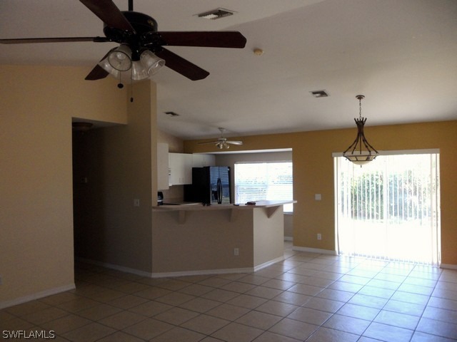 18395 Fern Road Fort Myers, FL 33967 - Photo 3 of 21 a view of a kitchen with a sink and a refrigerator