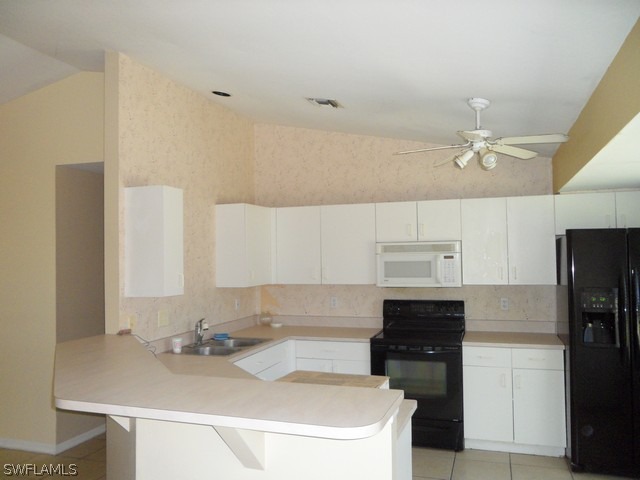 18395 Fern Road Fort Myers, FL 33967 - Photo 8 of 21 a kitchen with a sink appliances and cabinets