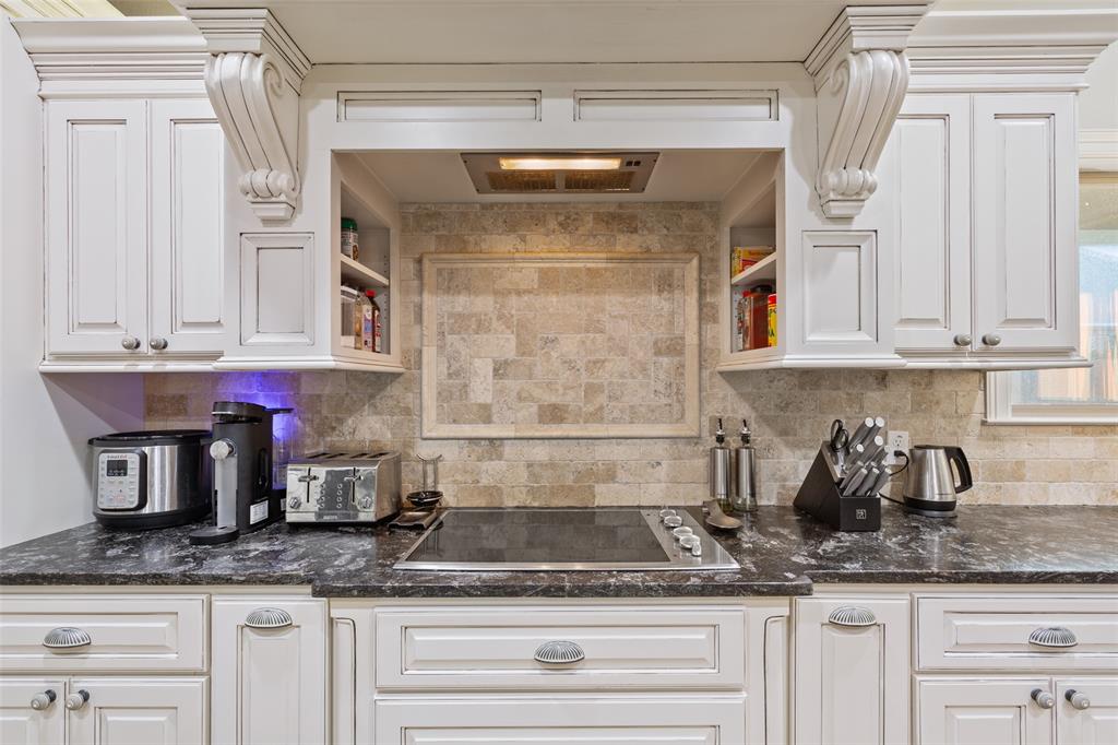 2313 Nicholas Waco, TX 76712 - Photo 11 of 36 a kitchen with granite countertop a sink and cabinets