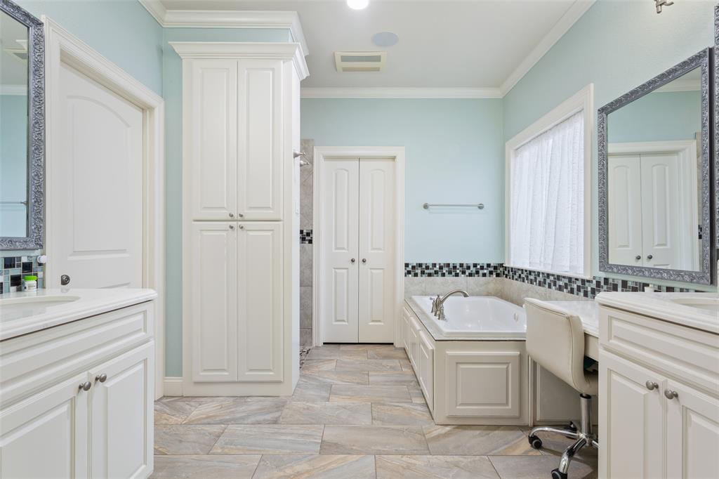 2313 Nicholas Waco, TX 76712 - Photo 16 of 36 a bathroom with a granite countertop sink a toilet a mirror and vanity