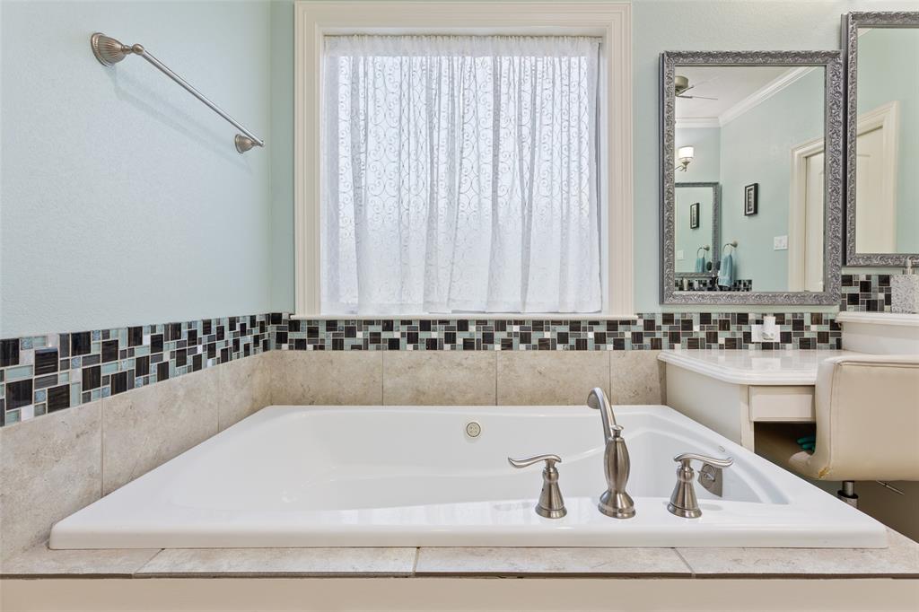 2313 Nicholas Waco, TX 76712 - Photo 19 of 36 a bathroom with a bathtub and a sink