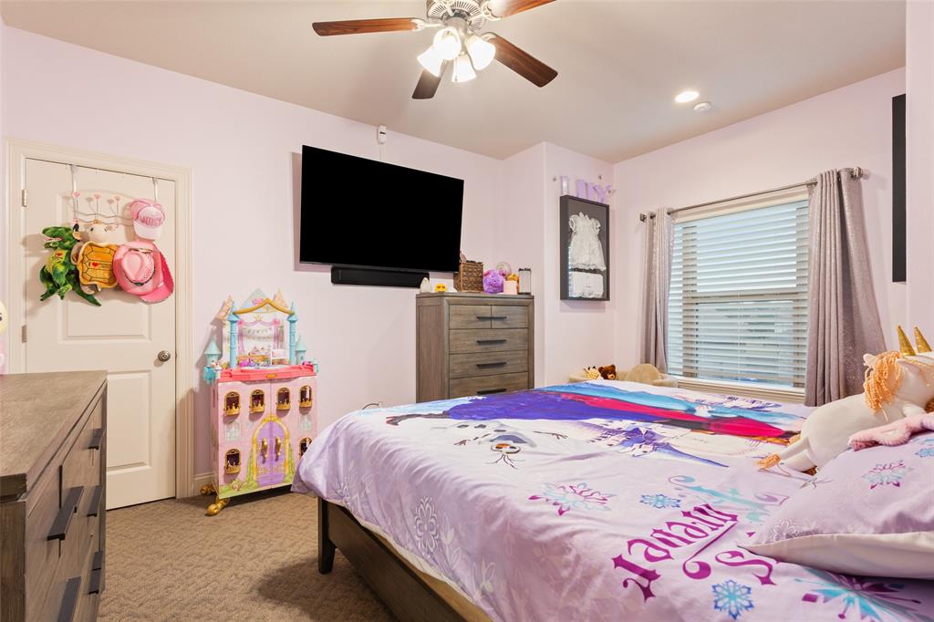 2313 Nicholas Waco, TX 76712 - Photo 24 of 36 a bedroom with a bed and a flat screen tv