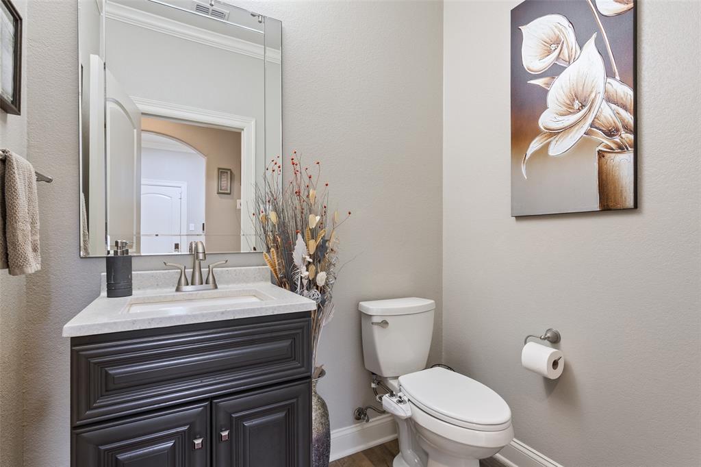 2313 Nicholas Waco, TX 76712 - Photo 25 of 36 a bathroom with a sink vanity mirror and toilet