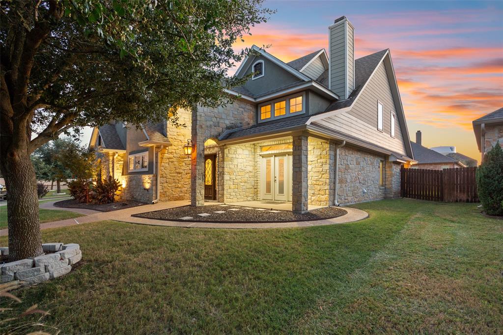 2313 Nicholas Waco, TX 76712 - Photo 35 of 36 a front view of a house with a yard and garage
