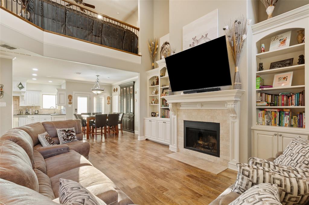 2313 Nicholas Waco, TX 76712 - Photo 7 of 36 a living room with furniture a fireplace and a flat screen tv