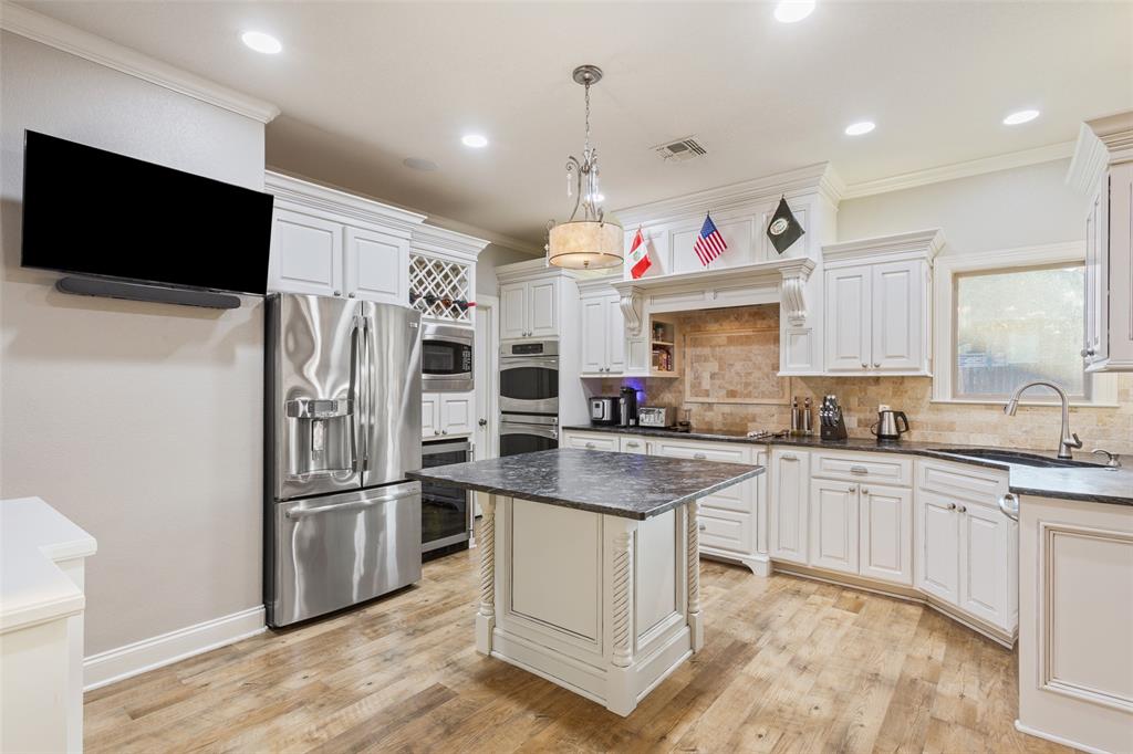 2313 Nicholas Waco, TX 76712 - Photo 9 of 36 a kitchen that has a microwave a stove and a refrigerator