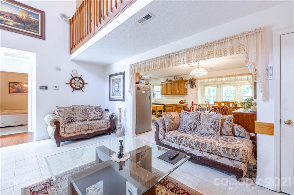 115 Banksridge Road Fort Mill, SC 29715 - Photo 12 of 29 a living room with furniture and a large window