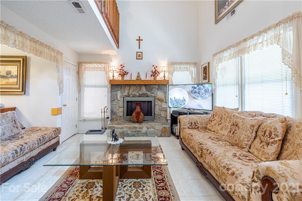 115 Banksridge Road Fort Mill, SC 29715 - Photo 14 of 29 a living room with furniture and a fireplace
