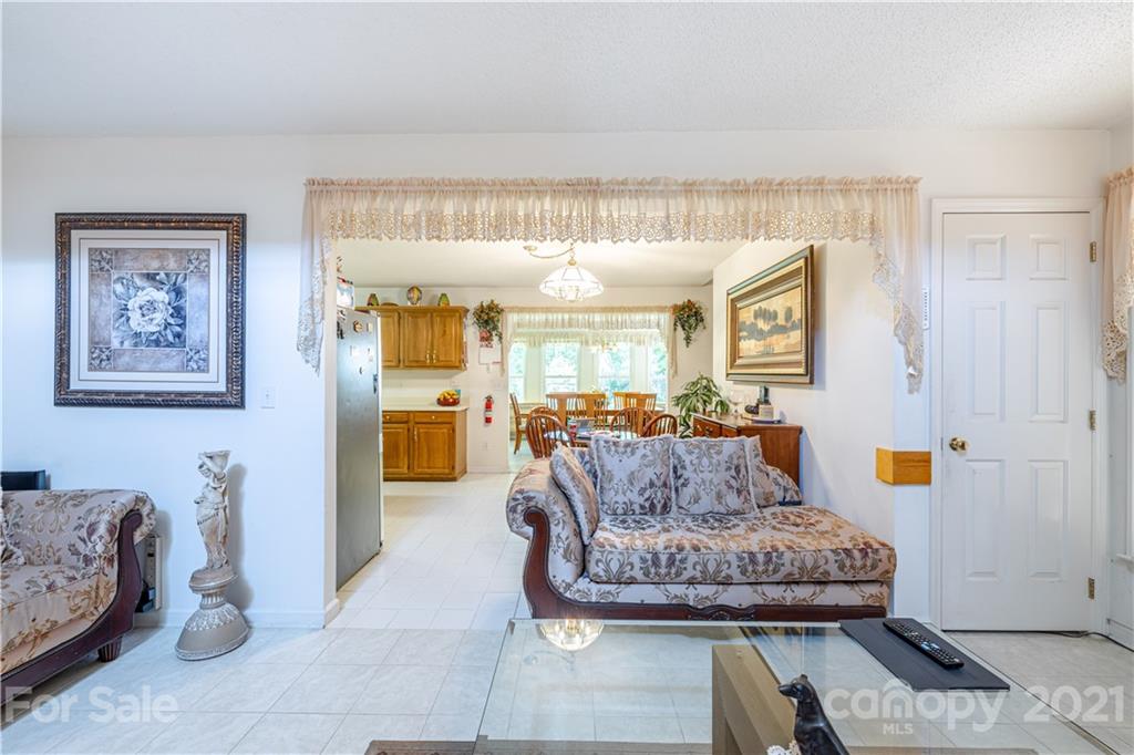 115 Banksridge Road Fort Mill, SC 29715 - Photo 15 of 29 a living room with furniture and a wooden floor