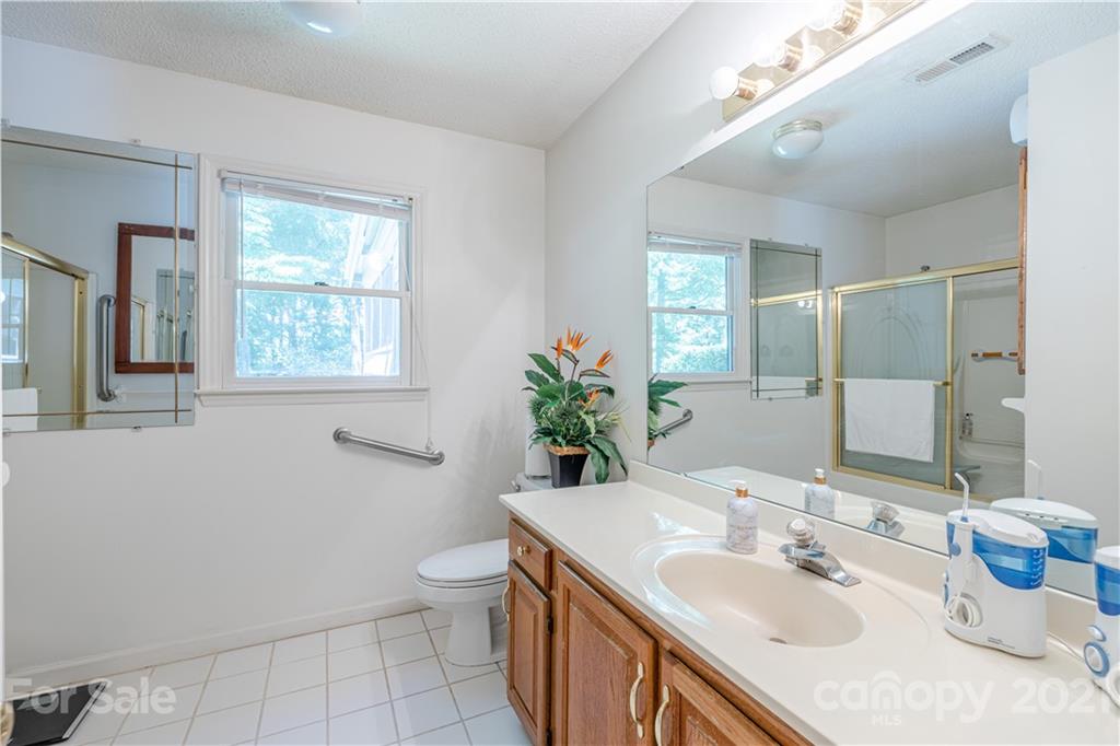 115 Banksridge Road Fort Mill, SC 29715 - Photo 24 of 29 a bathroom with a sink toilet and mirror
