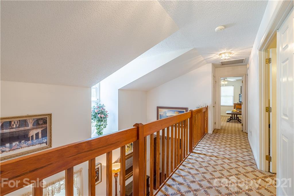 115 Banksridge Road Fort Mill, SC 29715 - Photo 25 of 29 a view of a hallway with wooden floor and windows