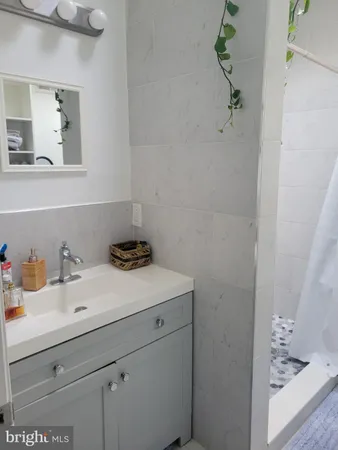 a bathroom with a sink and vanity