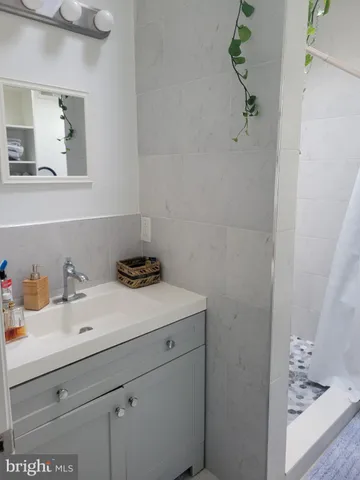 a bathroom with a sink and vanity