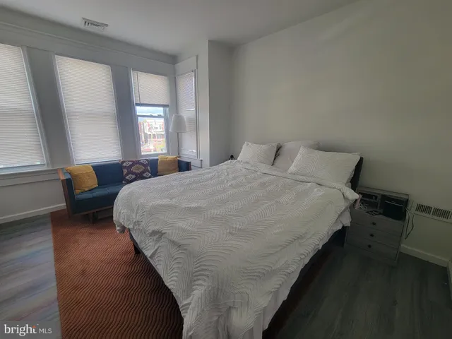 a bedroom with bed and window