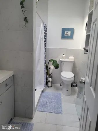 a bathroom with a toilet and a sink