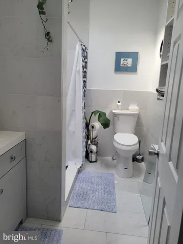 a bathroom with a toilet and a sink