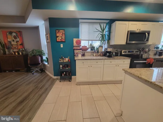 a kitchen with a cabinets and appliances