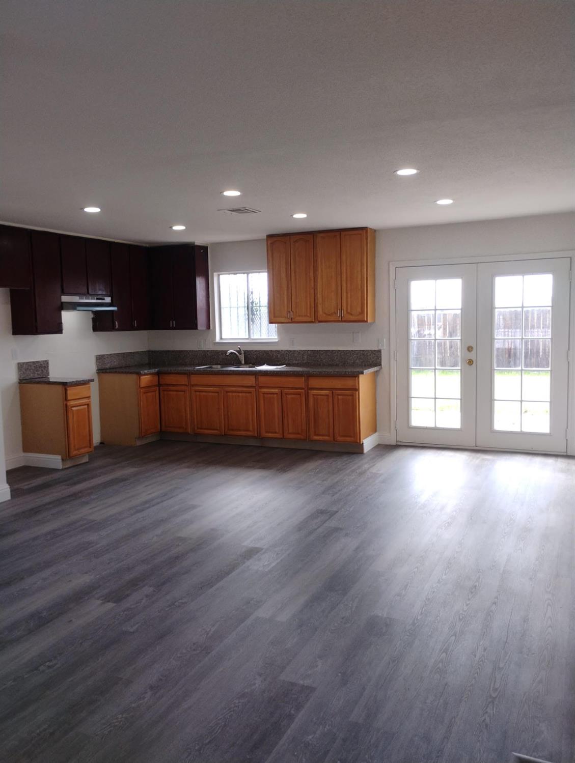 2540 Jordan Court Stockton, CA 95205 - Photo 3 of 5 a large kitchen with a large counter top and stainless steel appliances