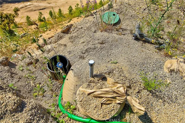 a view of mountain with sunset in background