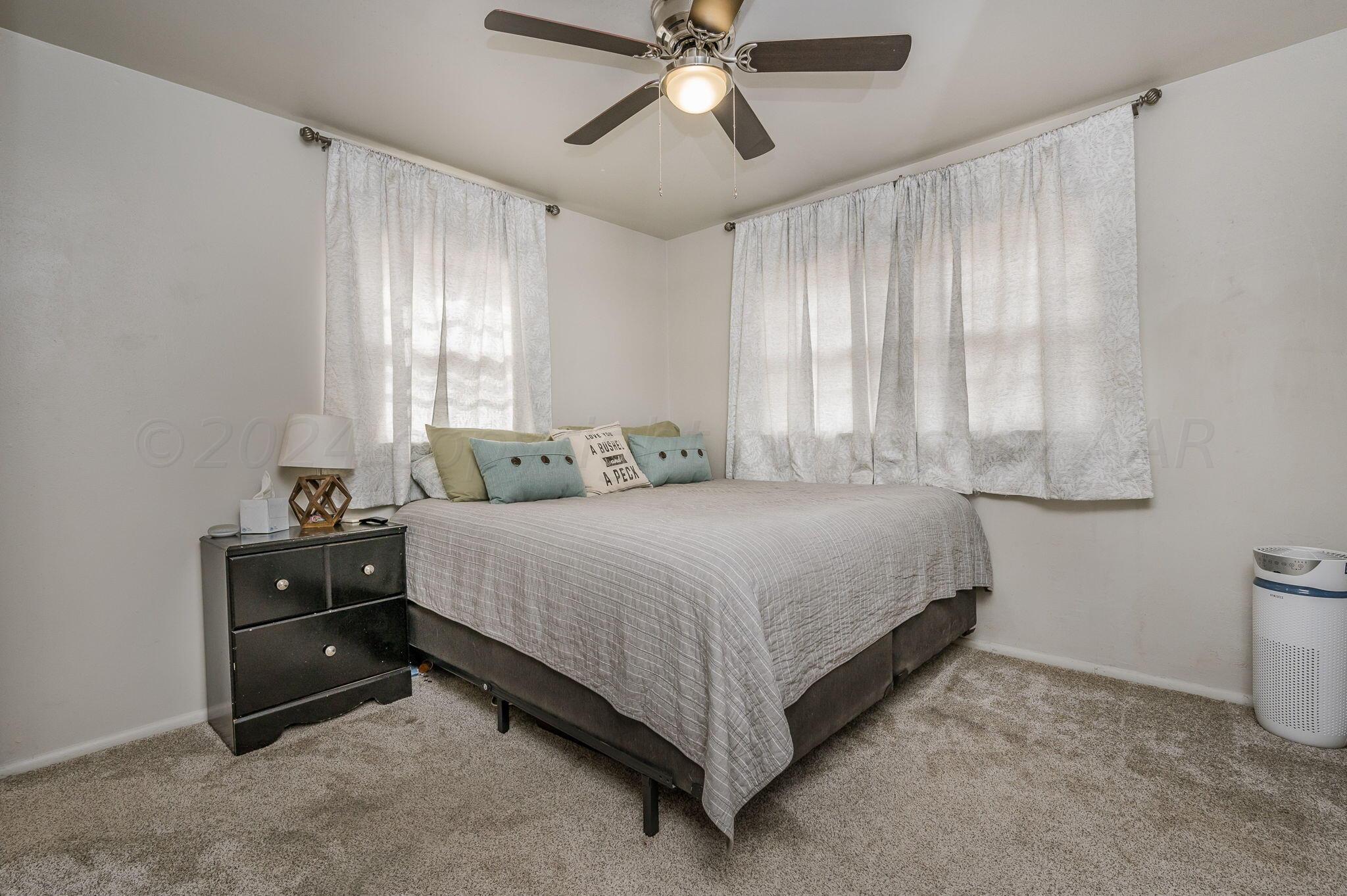 4205 South Bonham Street Amarillo, TX 79110 - Photo 12 of 24 a bedroom with a bed and window