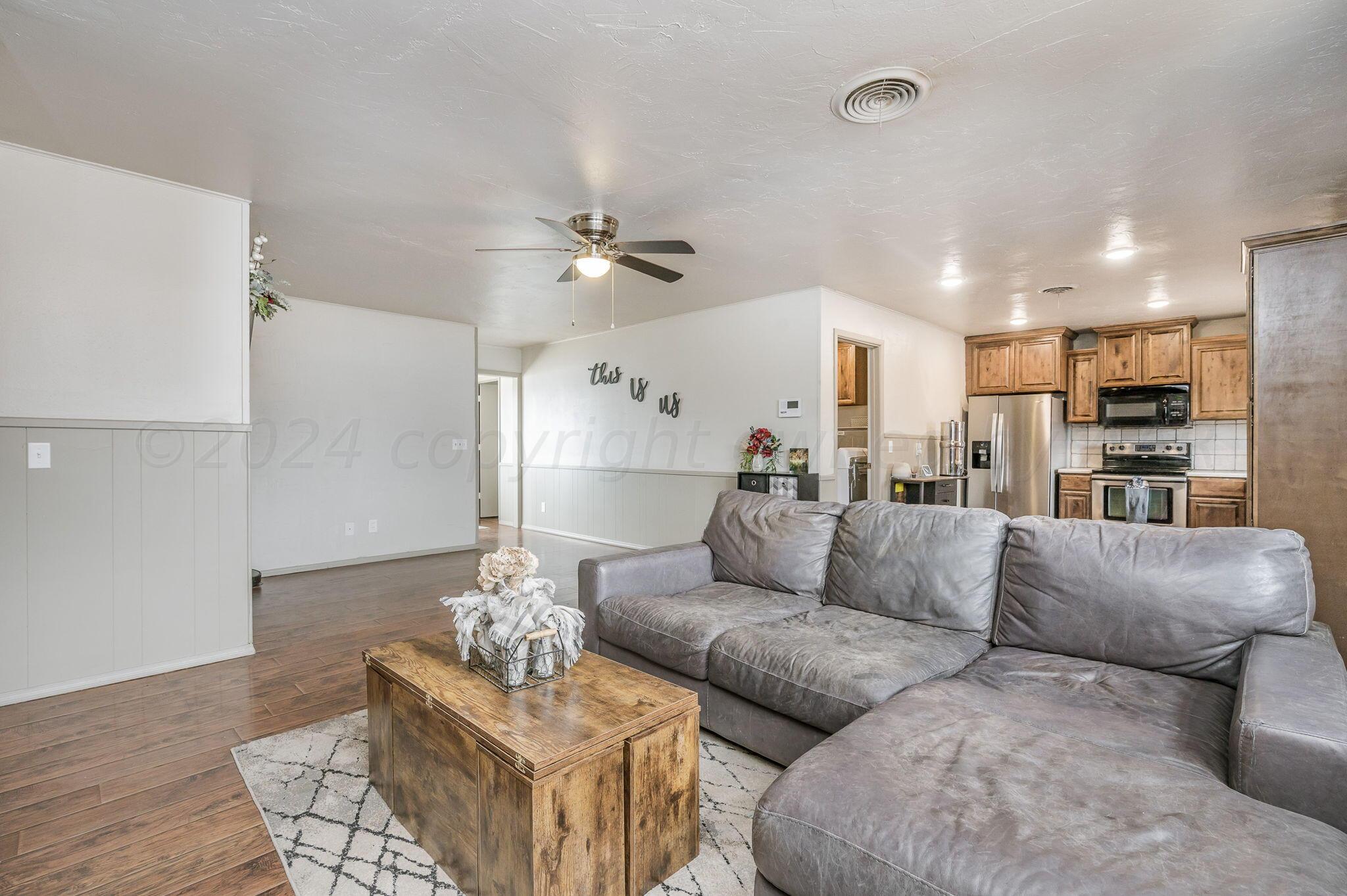 4205 South Bonham Street Amarillo, TX 79110 - Photo 6 of 24 a living room with furniture and kitchen view