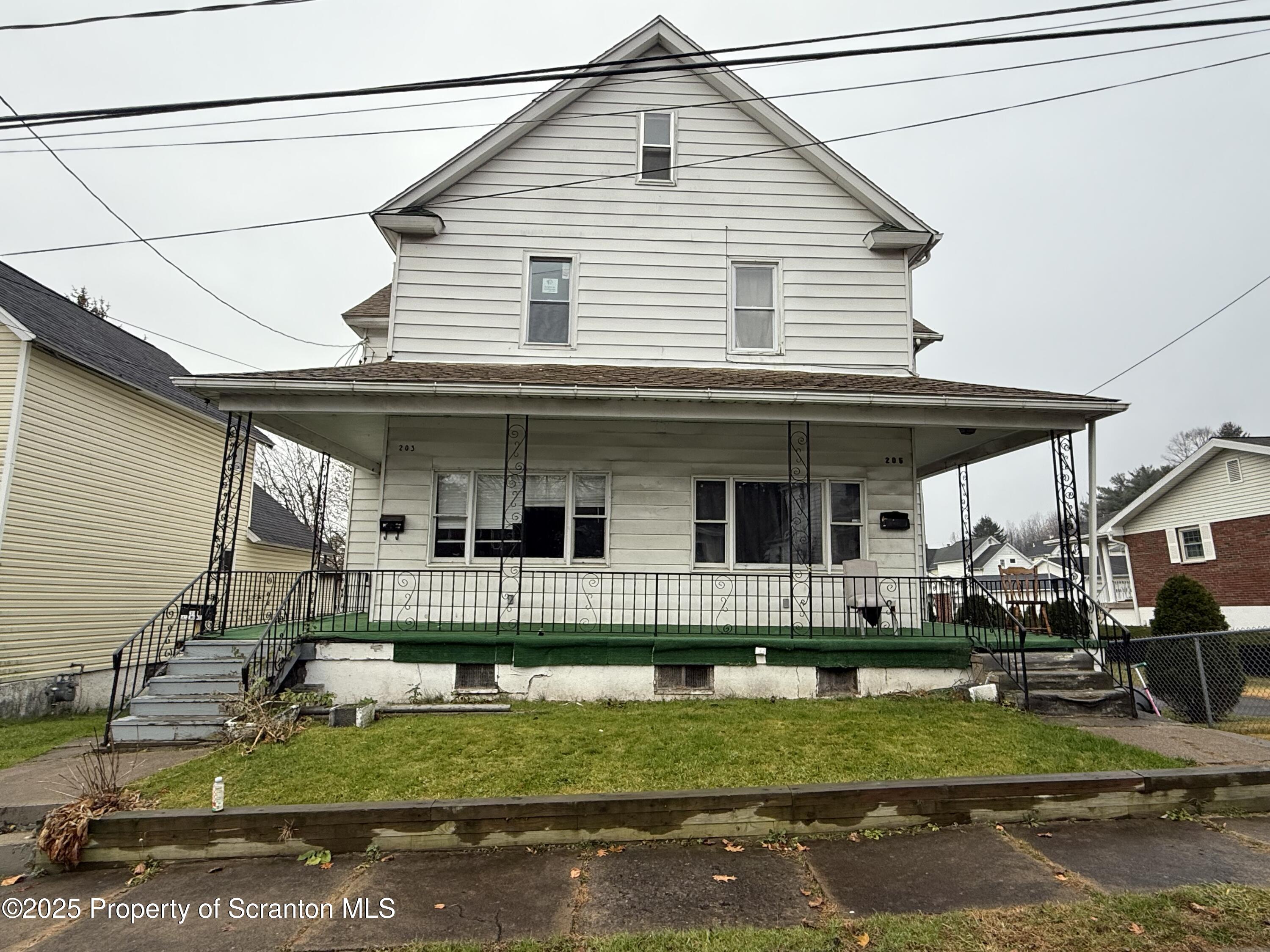 203 Greenbush Street Scranton, PA 18508 - Photo 2 of 20 a front view of house with a yard