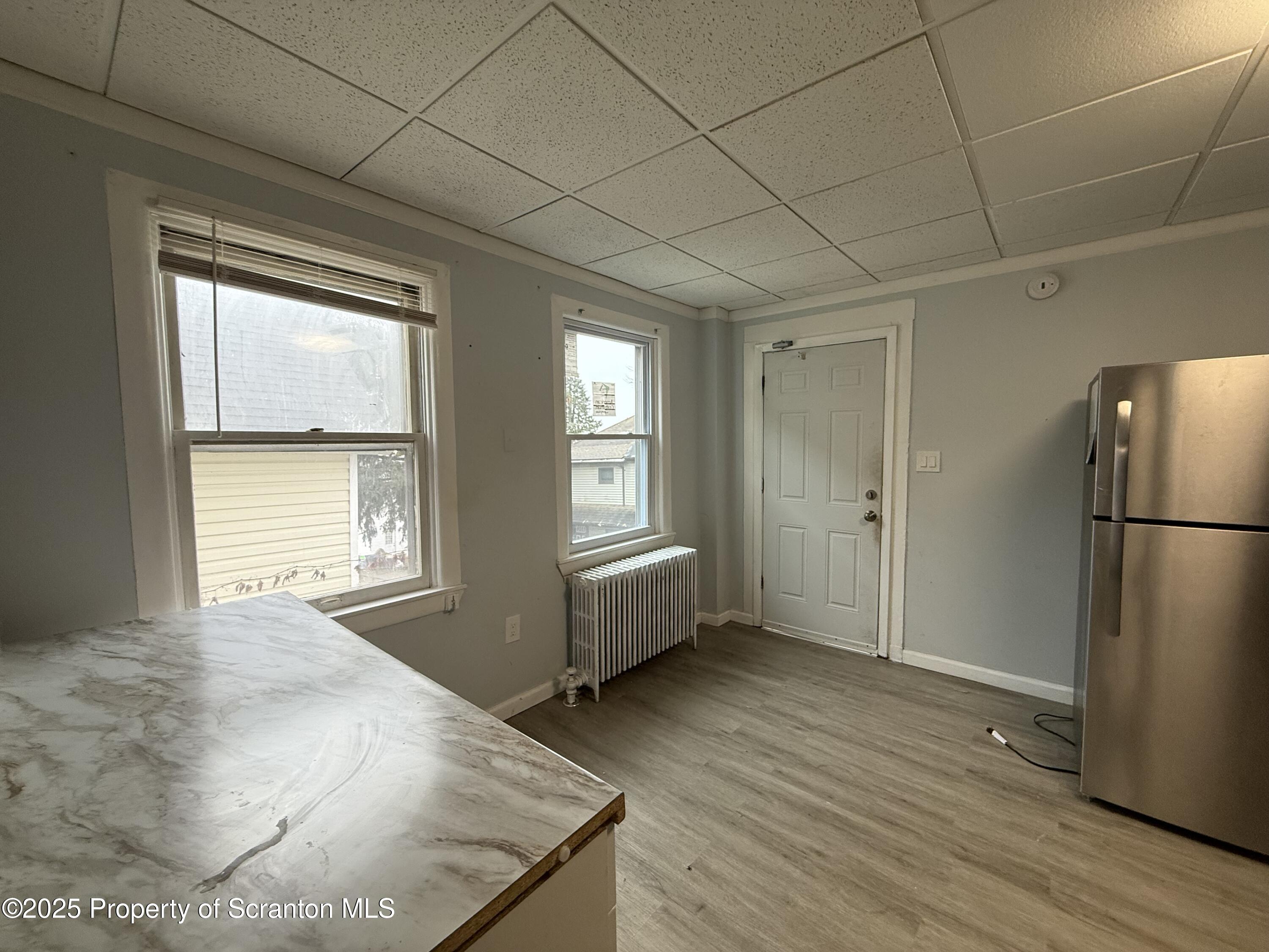 203 Greenbush Street Scranton, PA 18508 - Photo 8 of 20 a view of an empty room with a window