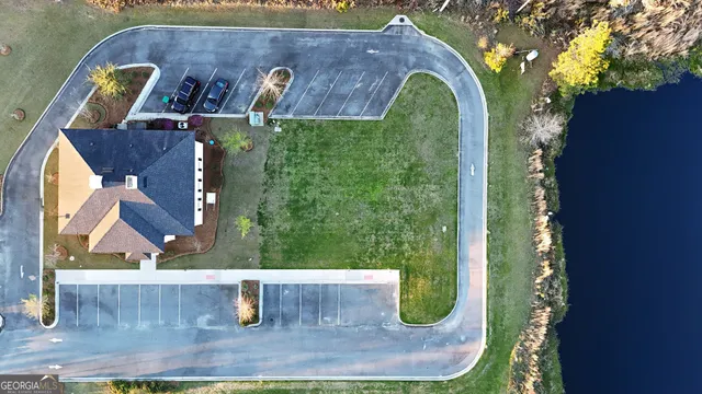an aerial view of a house with garden space and sitting space