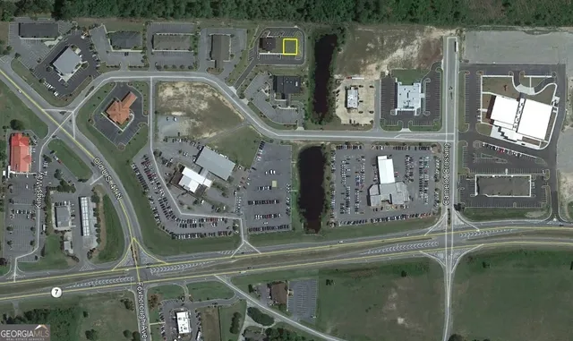 a front view of a house with a fountain