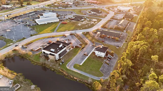 an aerial view of a house with a swimming pool