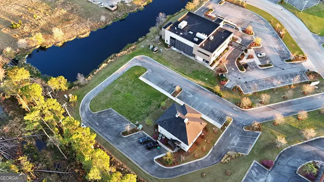 an aerial view of a house with a swimming pool