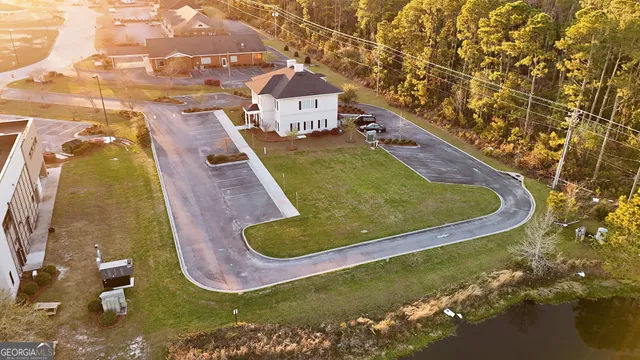 a view of a swimming pool with a yard