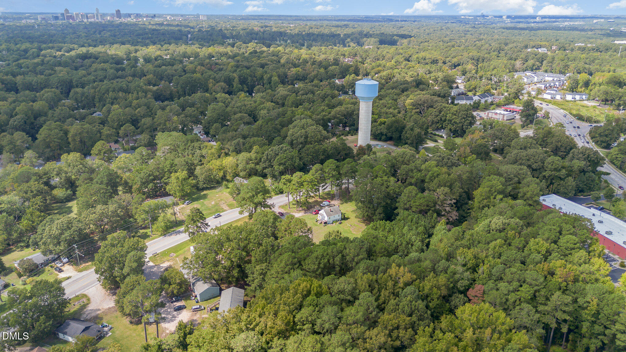 655-659 Sunnybrook Road Raleigh, NC 27610 - Photo 14 of 14 a view of a city with lush green forest