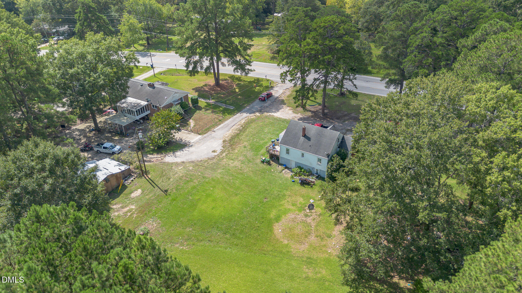655-659 Sunnybrook Road Raleigh, NC 27610 - Photo 5 of 14 an aerial view of residential house with outdoor space and trees all around