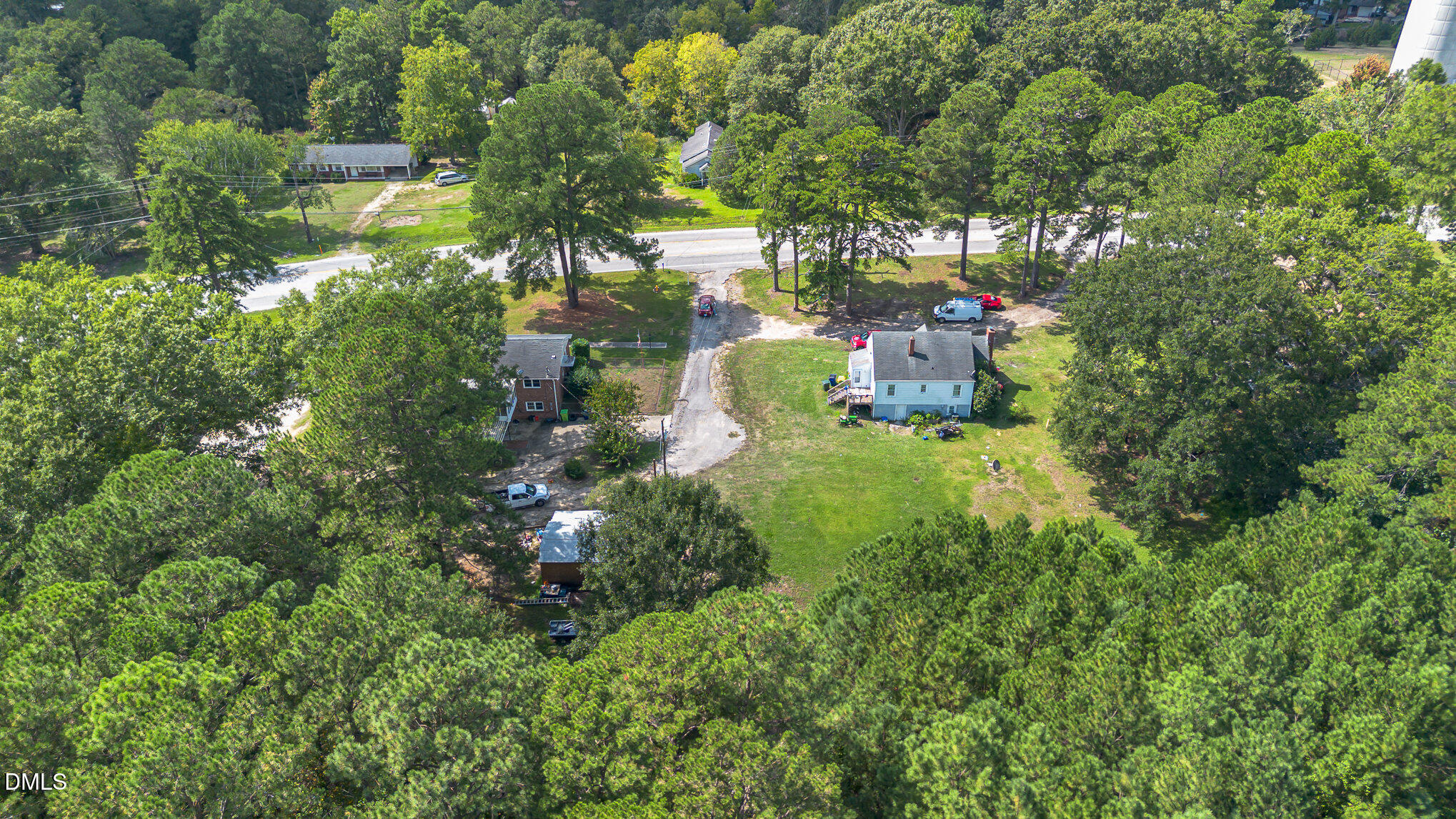 655-659 Sunnybrook Road Raleigh, NC 27610 - Photo 6 of 14 a backyard of a house with a yard and outdoor seating
