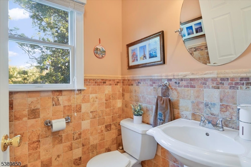 68 Horseneck Road Montville, NJ 07045 - Photo 13 of 34 a bathroom with a sink mirror and toilet