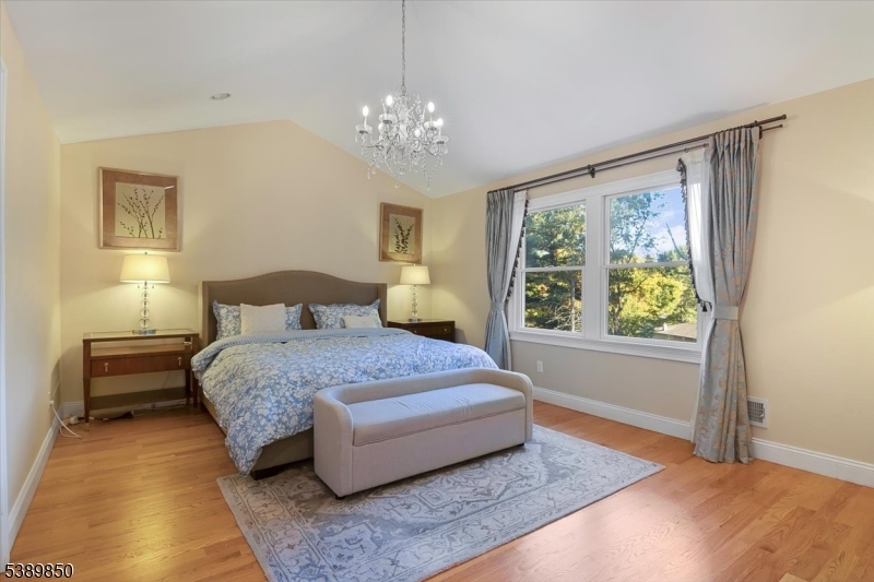 68 Horseneck Road Montville, NJ 07045 - Photo 14 of 34 a spacious bedroom with a bed and window