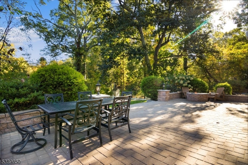 68 Horseneck Road Montville, NJ 07045 - Photo 25 of 34 a view of backyard with table and chairs and wooden fence