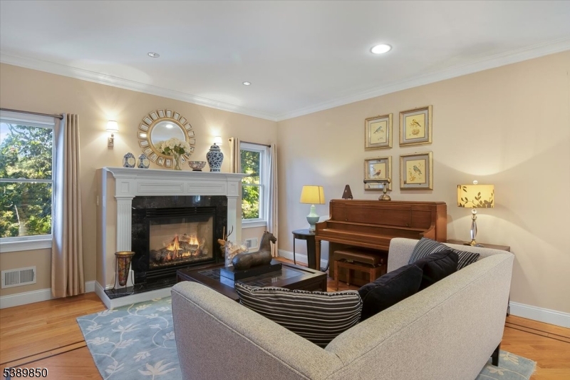 68 Horseneck Road Montville, NJ 07045 - Photo 7 of 34 a living room with furniture and a fireplace